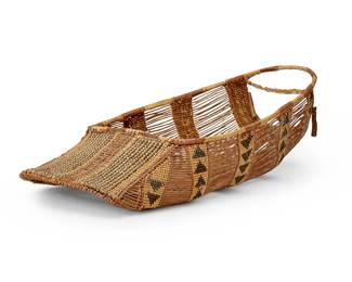 145
A Hupa/Yurok/Karuk basketry cradle
Early 20th century; Northern California
The polychrome cradle woven in natural, brown, and red, featuring alternating open warps and banded stacked triangle motifs
5.375" H x 16.5" W x 8.75" D
Estimate: $600 - $800