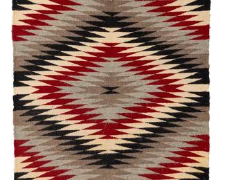 195
A Navajo regional weaving
Mid-20th century, Diné
Woven in red, cream, grey, brown, and black wool, featuring a central eyedazzler serrated motif
36" H x 26" W
Estimate: $200 - $400