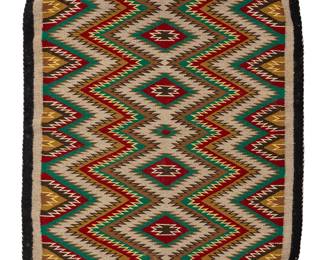 202
A Navajo eyedazzler weaving
Mid-20th century, Diné
Woven in multicolor wool, featuring an eyedazzler motif within a black and grey border
33" H x 22.5" W
Estimate: $300 - $500
