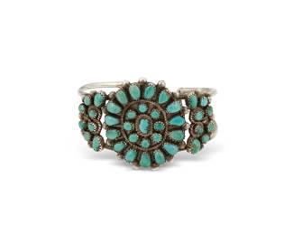 275
A Southwest silver and turquoise cuff bracelet
Mid-20th century
Unmarked
A two-wire cuff with cluster-set and petit point turquoise plaques and flanking shoulders
6 3/8" inner C x 1 5/8" H, with a 7/8" gap
35.5 grams gross
Estimate: $300 - $500
