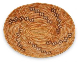 112
A California Mission polychrome basket
Early 20th century; Southern California
The coiled oval basket with scattered yellow and brown spiraling stepped motifs
3" H x 16.25" W x 12.875" D
Estimate: $800 - $1,200