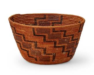 133
A Yokuts polychrome basket
Early 20th century; Southern California
A coiled basketry bowl with red spiraling stepped motifs outlined in brown
3.875" H x 6.75" Dia.
Estimate: $200 - $400