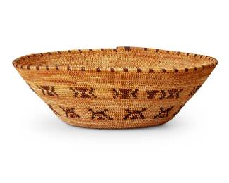 127
A Yokuts polychrome basketry bowl
Early 20th century; Southern California
The coiled flared bowl with two bands of brown and red butterfly motifs and rim ticking
3.125" H x 9.375" Dia.
Estimate: $600 - $900