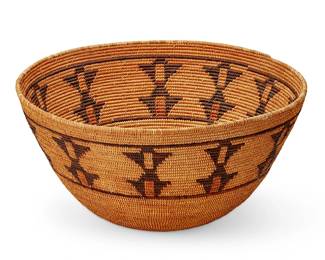 124
A California Mission polychrome basket
Early 20th century; Central California
The large coiled basketry bowl with banded geometric motifs woven in brown, with red accents
8.75" H x 17" Dia.
Estimate: $1,000 - $1,500