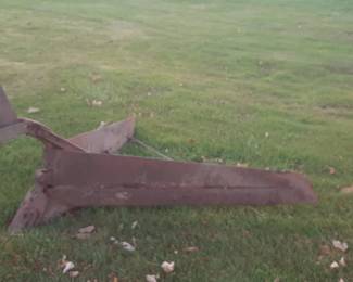 antique heavy v plow. 