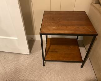 $48 (as found) Wood and metal side table with one shelf. The table measures 18.5 inches wide by 20 inches deep by 22 inches high. Available for online purchase