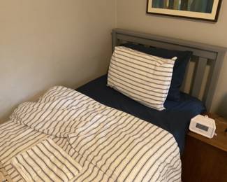 Photo of the second in a pair of twin beds.