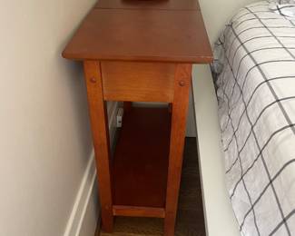 $140 for pair. One of a pair of hinged top wood bedside tables. 23” x 11” x 24” high. Available for online purchase.