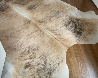 $260 cowhide rug measures approximately 9’ x 8’. Available for online purchase.