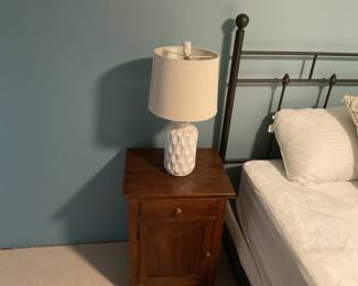 One of a pair of ceramic base bedside lamps available for in person purchase Friday and Saturday
