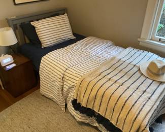 $380 One of two gray wood frame twin beds by Max and Lily. 42.5 inches wide by 80.75 inches long. The headboard is 37 inches high, and the footboard is 20 inches high. Sold with mattresses. Available for online purchase.