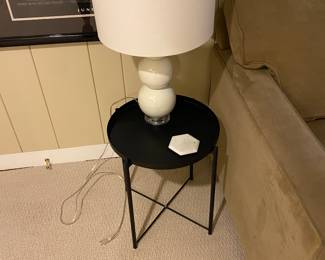 Black metal tray table and ceramic based lamp available for in person purchase Friday and Saturday.