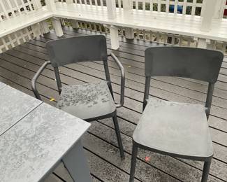 Photo of one captains chair and one side chair. Variance in color is due to rain/water.