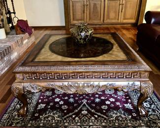 Close-up view of large square fancy coffee table