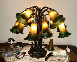 Close up view of Tiffany style Meyda Tulip Bulb table lamp, dimly lite