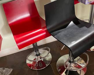 3 of these bar stools, 2 red, 1 black