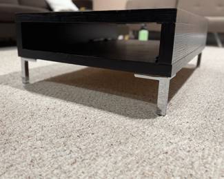 Domicile Furniture Modern Black Coffee Table with Chrome Base. Measures 27" x 38" x 12.5" H. Photo 1 of 2.