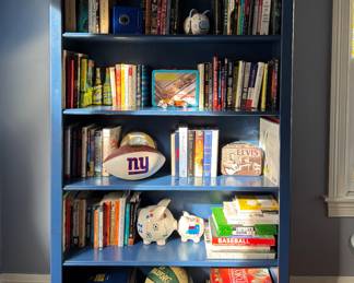 Land of Nod Dark blue Brighton Bookcase. Measures 44" W x 73" H. (ITEMS IN BOOKCASE ARE NOT FOR SALE).