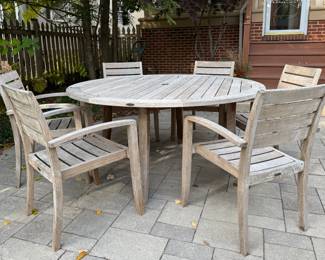 Crate & Barrel Trovata 62" Round 7-Piece Outdoor Dining Set. Photo 1 of 2.