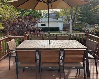 Create & Barrel Rocha Rectangular Power-Coated Aluminum 8-Piece Dining Table Set. Table Measures 35.5" W x 82" L. Chairs Stack In Sets of 4 For Easy Storage. Photo 1 of 3.