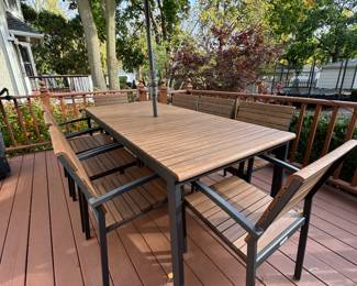 Create & Barrel Rocha Rectangular Power-Coated Aluminum 8-Piece Dining Table Set. Chairs Stack In Sets of 4 For Easy Storage. Table Measures 35.5" W x 82" L. Photo 2 of 3.