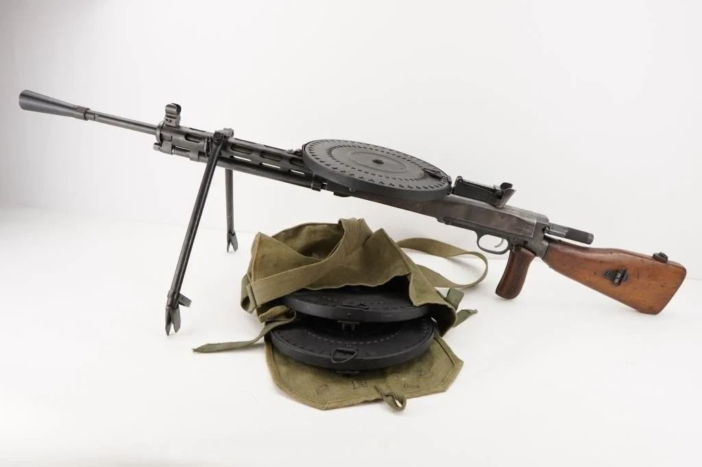 Make: BW Customs
Model: DP-28
Caliber: 7.62x54
Action: Semi
Barrel: 28
Bore: Shiny
Serial # RA0120
Condition: Very Good
The Degtyaryov machine gun or DP-27/DP-28 is a light machine gun firing the 7.62×54mmR cartridge that was primarily used by the Soviet Union, with service trials starting in 1927, followed by general deployment in 1928. This converted rifle features a 28" barrel and is sold with 3 drum mags and original case for the mags. 