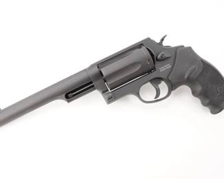 Make: Taurus Armas
Model: Th Judge
Caliber: .410/.45 LC
Action: DA
Barrel: 6.75
Bore: Shiny
Serial # ACG037260
Condition: Very Good
Importer: Taurus Int MFG
Taurus Judge Magnum 45 (Long) Colt/410 6.5in Blued Revolver - 5 Rounds - The Taurus Judge Magnum is capable of chambering both .410 gauge 2.5" or 3" shotshells and 45 Colt ammunition. This amazing combo is ideal for short distances where most altercations occur, or longer distances with the 45 Colt ammo. Taurus has finely tuned the rifling to spread the shot pattern at close quarters or to guide the .45 caliber bullet to the target. This model has a 6.5" barrel with a fiber optic front sight and fixed rear. It has a matte black metal finish and a black rubber grip. The revolver is in very good condition, showing normal signs of use and wear.