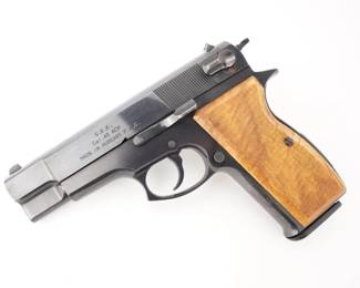 Make: F.E.G.
Model: G.K.K.
Caliber: .45 ACP
Action: Semi
Barrel: 5
Bore: Shiny
Serial # AA010165
Condition: Good
Importer: SSME
The .45acp Model GKK-45 (Kompakt) is the same pistol as the FÉG Model ACK-45 except for the different model designation for export. The 'GKK' designation was given to the pistol by the importer, Michael Kassnar of KBI, Inc, after the initials of his daughter. The 2nd K should stand for 'Kompakt', indicating a shorter barrel. The revolving type firing mechanism, flying firing pin and the rotating safety latch are incorporated into the slide. The barrel latching in the slide is done via three latching ribs. The pistol is equipped with an external hammer with a safety rest to avoid accidental discharge. Chambered in .45 ACP and sold with one magazine, this pistol is in good condition, showing some signs of holster wear. 