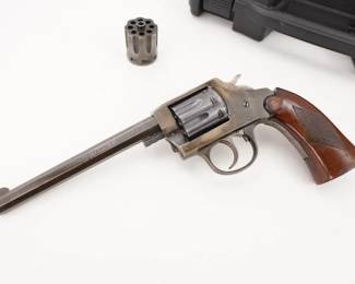 Make: Iver Johnson
Model: Target Sealed 8
Caliber: .22 LR
Action: SA
Barrel: 6
Bore: Shiny
Serial # 6510
Only 13,100 prewar octagon barrel Target Sealed 8 revolvers were made (another 134,140 round barrel versions were made after the war up to 1954). This revolver features the markers mark upon the top of the barrel, I. J. A.& C. W. Their model number is 68 but most people refer to them as the Target Sealed 8. This pistol was made during its First year of production and features a 6” shiny barrel and additional cylinder. This revolver remains in very good condition for its age showing normal signs of use and wear. Sold with Plano Hard Case. 