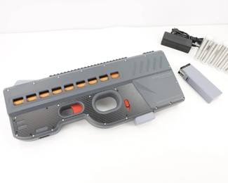 Make: Coil Accelerator
Model: CA09
Action: SEMI/BURST/AUTO
Barrel: 12
Serial # 20220398305
Condition: GREAT
As seen on the Demolition Ranch, the first ever commercially viable electric powered Coil Accelerator! Using a series of electromagnetic coils,The Coil Accelerator can expel nickel plated iron projectiles at various velocities and rates of fire. Features: Near silent operation, Zero muzzle flash, Smokeless, Single component projectile, One touch velocity/ fire selector, Nearly no recoil ,Great stopping power, Max rate of firing: 2400 rounds/min, No residue And No Cleaning. This Gen 1 model is sold with the factory box, 2 mags, charger and ammo! It remains in excellent condition showing normal signs of use and wear.