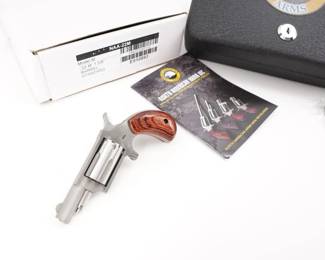 Make: North American Arms
Model: NAA-22M
Caliber: .22 MAG
Action: SA
Barrel: 2
Bore: shiny
Serial # E510893
Condition: Great
The ultra-compact and lightweight North American Arms NAA-22M is a single-action revolver meant for deep concealment. Stainless steel construction resists the corrosive effects of carrying a firearm close to the body where perspiration can cause problems. The rosewood, bird's head grip conceals well and provides an adequate hold. The half-moon front sight enables the shooter to draw the revolver from a pocket or purse without getting snagged. The NAA-22M Single-Action Revolver takes up minimal space, making it a great gun to have close at hand at all times. This Revolver is sold with factory box and lock case. This revolver is in Great condition showing normal signs of use and wear. 