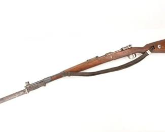 Make: GUSTLOFF WERKE, WEIMAR
Model: 98
Caliber: 8mm
Action: Bolt
Barrel: 24
Bore: Bright
Serial # 626r
Condition: Excellent
Importer: NVI
1943 K98k 8mm bolt action rifle. Manufacturer’s code bcd serial number 626r stamped on action, bolt matches itself serial number 626r. Firing Proofs Nazi-style eagles. Acceptance Stamps Waffenmamts w/Nazi -style eagles. Upper band closed, lower band, floorplate, follower, trigger guard and floor plate are all milled. Stock is laminated and in excellent condition with cupped buttplate. Rifle includes a hooded front sight, cleaning rod and original leather sling. Rifle also includes an original K98k bayonet serial number 6985 factory code cqh (Clements & Jung, 1941/44), and original scabbard serial number 9894g factory code 43 cvl (WKC, 1940/44).