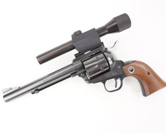 Make: Ruger
Model: Blackhawk
Caliber: .357 Magnum
Action: SA
Barrel: 6.5
Bore: Shiny
Serial # 87614
Condition: Very Good
The Ruger Blackhawk is a six-shot, single-action revolver introduced in 1955. Chambered for the .357 Magnum originally, the Blackhawk was a simple and strong design. This revolver was manufactured in 1967 as indicated by the serial number (87614) and is chambered in .357 Magnum. The single action revolver has a 6.5” barrel paired with a scope.. The revolver is in Very Good condition, showing normal signs of use and wear.