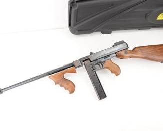 Make: Auto Ordnance
Model: Thompson 1927 A1
Caliber: .45 ACP
Action: Semi
Barrel: 18
Bore: Minty
Serial # KH8087
Condition: Like New
Country: Rifle
The .45 ACP caliber Thompson 1927A-1 has a pinned Cutts compensator, which lengthens the finned barrel length to 18”, and puts the overall length for the carbine at 41” from buttstock to muzzle. They have a blade front and open rear adjustable sight. The fixed stock is crafted in luxurious polished American Walnut and has a vertical foregrip. This Rifle is sold with a Stick mag and case. This rifle Remains in Excellent condition showing little signs of use.