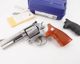 Make: Smith & Wesson
Model: 686-3
Caliber: .357 Magnum
Action: DA
Barrel: 4
Bore: Shiny
Serial # CUD1303
Condition: Excellent
Smith & Wesson L-Frame revolvers are built to suit the demands of the most serious firearms enthusiast. Available in six and seven shot cylinders, the L-Frame has a strong, durable frame and barrel built for continuous Magnum usage. As police officers and hunters will attest, this firearm is made to withstand heavy use. This S&W 686-3 is chambered in .357 magnum and features a 4” barrel paired with Red wood grips. This revolver is sold with Factory case and grips.. The double action revolver is in excellent condition, showing minimal signs of use and wear.