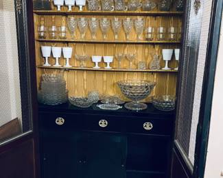 This cabinet is an absolute stunner.  More details to follow.  Here they've used it as a bar.  Fantastic.  Filled with milk glass and Fostoria. 