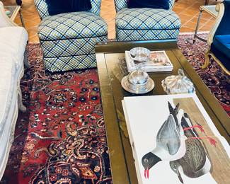 Vintage Mid-Century Shell back upholstered rolling chairs.  Love. Large incredibly gorgeous area rug, Lacquered Coffee Table, Coffee Table Books, Sterling silver and Silver Plated Dishes.  Love all of it.