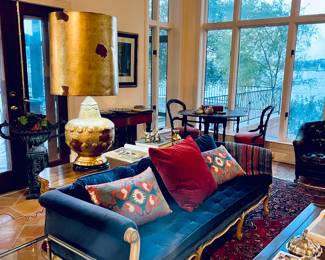 Blue Velvet Antique Couch.  Beautiful Condition. If you look to the lamp behind the couch, there are actually two of them.  They are exceptional and I'd love to have them both. 