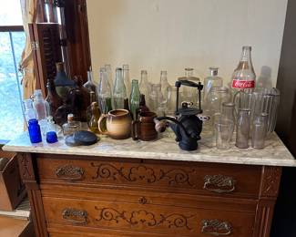 vintage bottles, glassware, vintage dresser