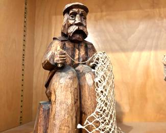 Carved fisherman