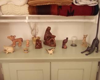 Handmade artisan items. The cat on the right is cast iron.