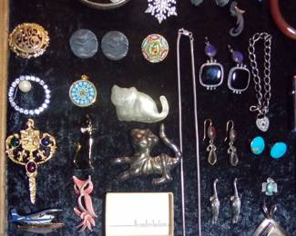 red carnelian bangle, millefiori pendant , Herkimer diamond, 1969 Texaco Zippo (cleaned up well) unused, Italian Micro Mosaic, Everett & Mary Teller Navajo Lapis and sterling earrings, Geode pendant necklace and a bunch of sterling. Nice quality jewelry folks.