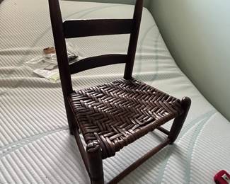 #55	vintage kid's chair with basket weave seat, 8" tall	 $25.00 
