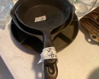 #142	Set of 3 Cast Iron Skillets  Cornbread Skillet, and No 3 and No 4 skillet	 $20.00 			
