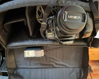 #111	Minolta  Camera w/bag and 1 lens & Flash 	 $25.00 
