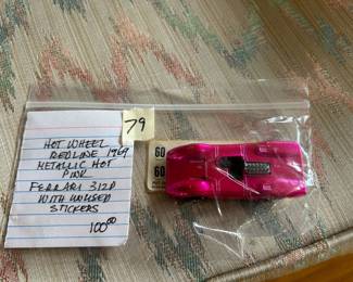 #79	hot wheels redline 1969 Metallic hot pink Ferrari 312D with unused stickers 	 $100.00 
