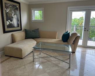 Custom made sofa (matching section in another photo) covered in Sunbrella fabric.