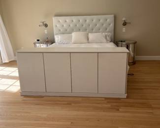 Cabinet at bottom of the bed has a hidden TV that raises up with a remote control