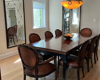 Baker Table with 10 Chairs (2 not shown) 70 " without leaves. Shown with one leaf + 30" so with the 8 chairs it's 100".  The maximum length is 130" x  42"