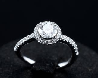A vibrant GIA Natural Diamond Engagement Ring - a beautiful round brilliant diamond set in a halo sytle setting.

GIA Report #: 1395819402, Measurements: 5.72-5.76 x 3.49mm

Carat Weight - .70, Color Grade - D, Clarity Grade Si1, Cut Grade Excellent, Polish - Excellent, Symmetry - Excellent, Fluorescence - none, Clarity Charactristics - Feather

GIA inscription - visible with microscope